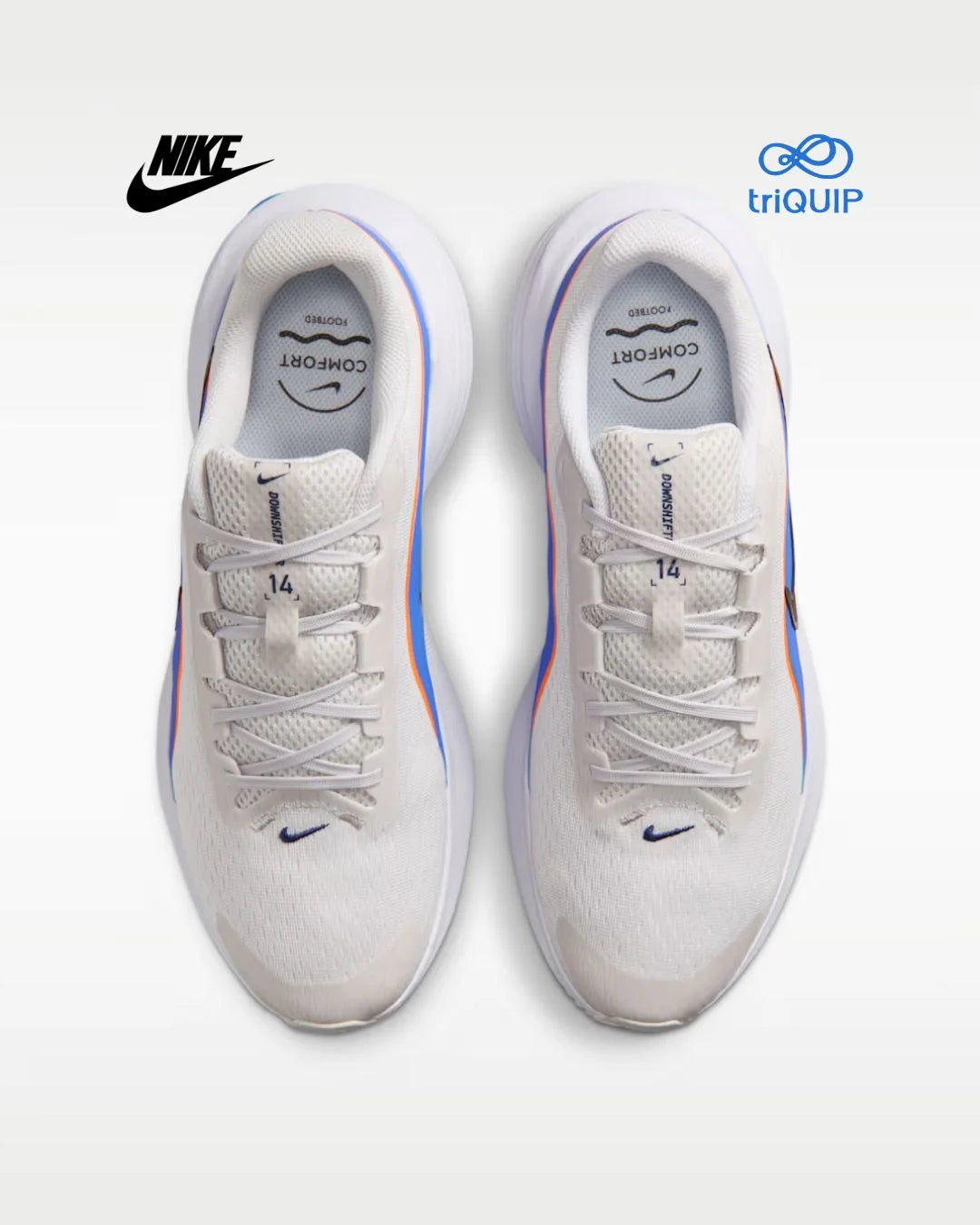 A pair of Nike running shoes in white, shown from a top-down view on a light gray background. The shoes feature blue and orange accents along the side and a blue Nike Swoosh near the toe.
